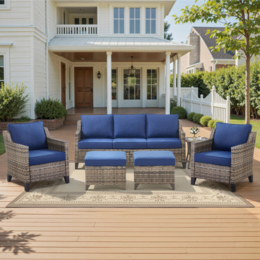 Belord 6-piece wicker patio conversation set with sofa, two chairs, two ottomans, and side table for outdoor lounging.