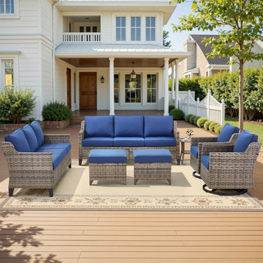 Belord 7-piece patio conversation set with sofas, two swivel chairs, two ottomans, and side table for outdoor seating.