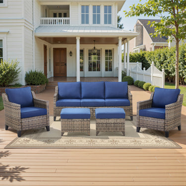 Belord 5-piece outdoor lounge set with high-back wicker couch, two patio chairs, ottomans, and plush cushions for patio relaxation.