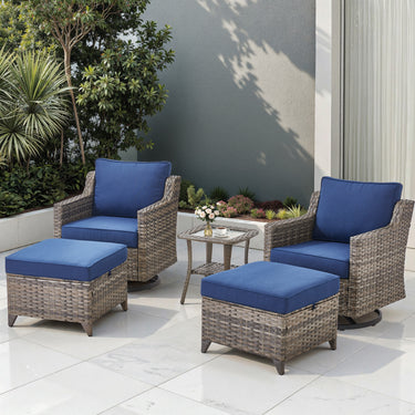 Outdoor Belord patio conversation set with 2 swivel glider chairs, ottoman pair, and glass accent table in a garden setting.