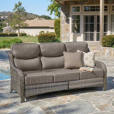 Belord oversized 3-seater wicker sofa with high back and 6-inch cushions, perfect for outdoor or patio seating.