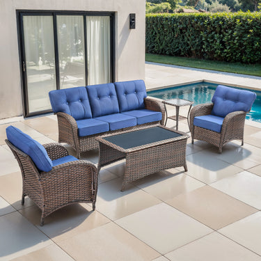 Belord 5-piece patio conversation set with brown wicker frame, blue cushions, including sofa, chairs, side table, and coffee table.