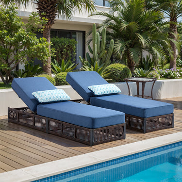 Belord 3-piece patio lounge set with brown wicker chaises, blue cushions, and side table, perfect for outdoor conversation.