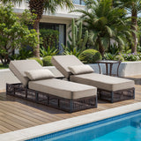 Brown wicker patio lounge set with two adjustable chaise lounges, beige cushions, and side table from Belord's 3-piece Ultimate Comfort series.