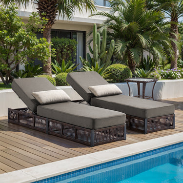 Brown wicker patio conversation set with two adjustable chaise lounges, grey cushions, and side table from Belord NTC series.