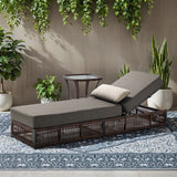 Belord patio lounge chair with brown wicker frame, grey cushions, and side table, part of the Solo Relaxation Set.