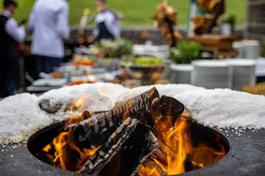 How to Host the Perfect Outdoor Dinner Party Around a Fire Pit Table?