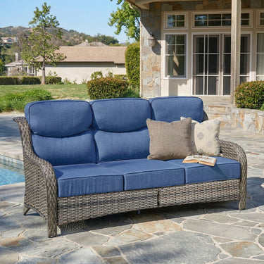 Belord oversized 3-seater wicker sofa with high back and 6-inch cushions, ideal for outdoor or patio lounging.