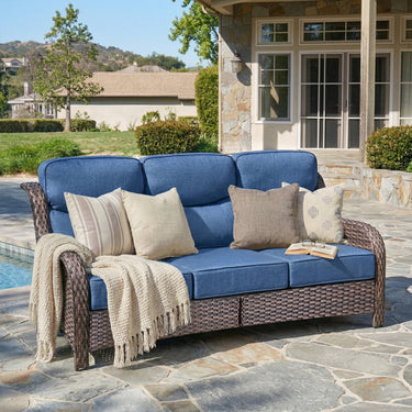 Belord oversized 3-seater wicker sofa with high back and 6-inch cushions, perfect for outdoor or patio lounging.