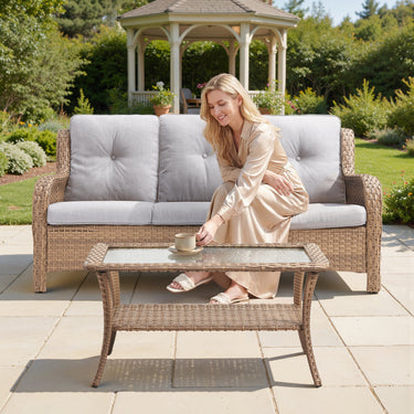 Belord outdoor wicker coffee table with glass top and storage shelf, part of the patio conversation sets from the NTC series.