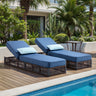 Belord 3-piece patio lounge set with brown wicker chaises, blue cushions, and side table, perfect for outdoor conversation.
