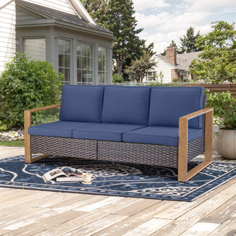 Belord deep-seat wicker patio sofa with blue cushions and wood grain frame, part of the HOP Series, designed for outdoor conversation.