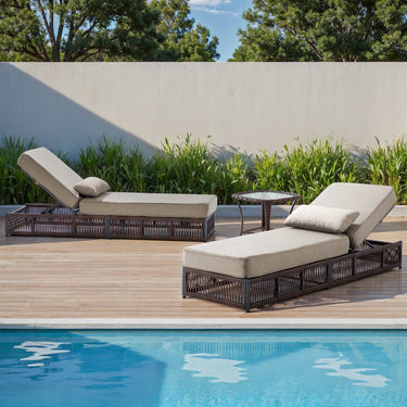 Brown wicker 3-piece patio lounge set with beige cushions, two adjustable chaise lounges, and a side table from Belord NTC Series.