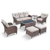 Belord 7-piece patio conversation set with brown wicker, beige cushions, includes sofa, chairs, tables, and footstools.
