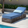 Belord brown wicker patio chaise lounge with blue cushion, 6-position recline, 5-inch thick cushion for outdoor relaxation.