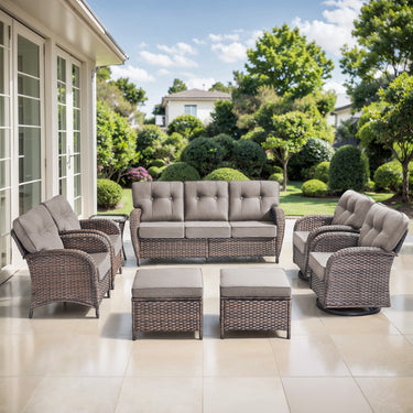 Belord outdoor patio conversation set with brown wicker sofa, swivel chairs, patio chairs, and grey cushions.