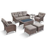 Belord 7-piece patio conversation set with brown wicker, grey cushions, includes sofa, chairs, tables, and footstools.