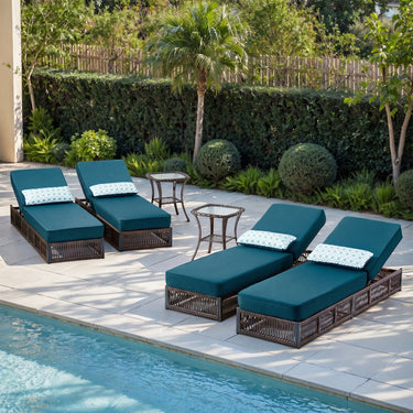 Belord 6-piece wicker chaise lounge set with four lounges and two side tables, part of the NTC series, outdoors on patio.