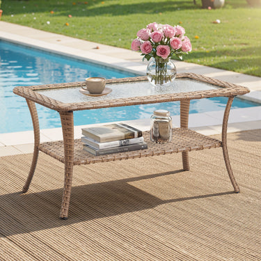 Belord outdoor wicker coffee table with glass top and storage shelf, ideal for patio conversation sets.