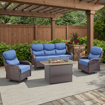 Belord small patio fire pit set with brown wicker swivel chairs, blue cushions, and rectangular fire table with wind guard.