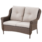 Belord wicker outdoor loveseat with high back and floral armrest design, perfect for patio seating.