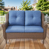 Wicker outdoor loveseat with high back and floral armrest design, Belord FL Series patio loveseat, black and white color.
